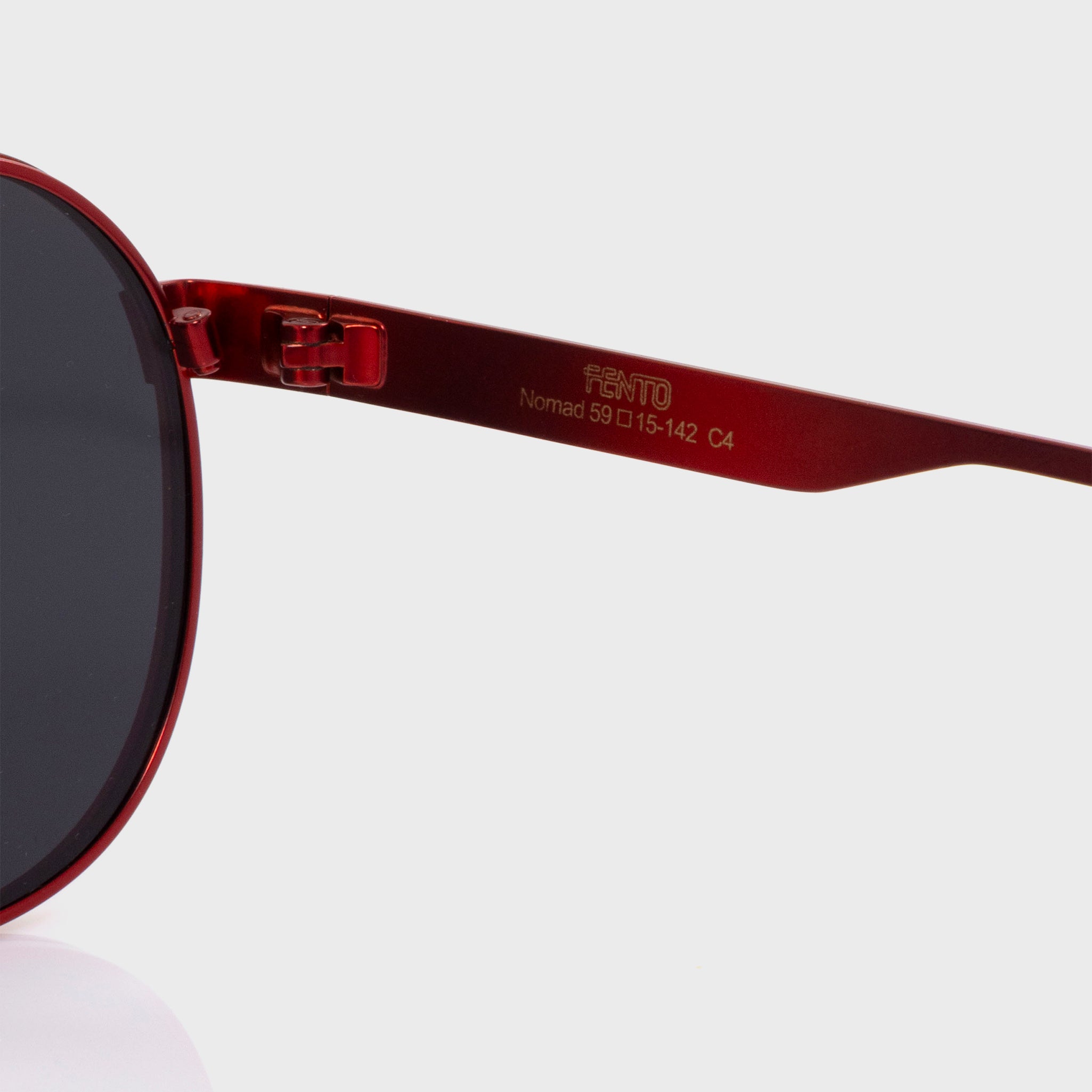 Nomad stainless steel sunglasses – vibrant red frame designed for everyday adventure.

