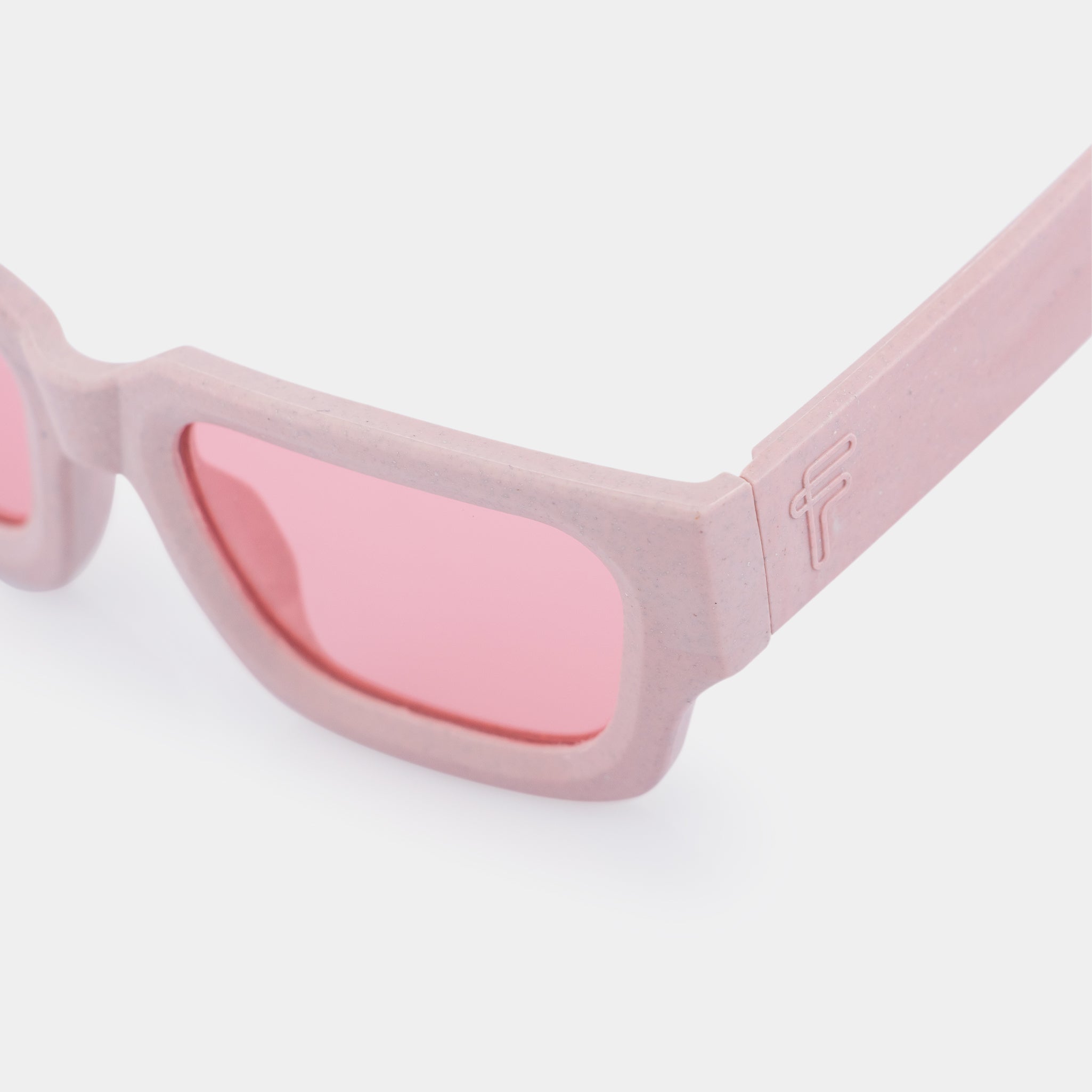 Recycled Tetra Pak sunglasses Go – strawberry pink frame with playful character.