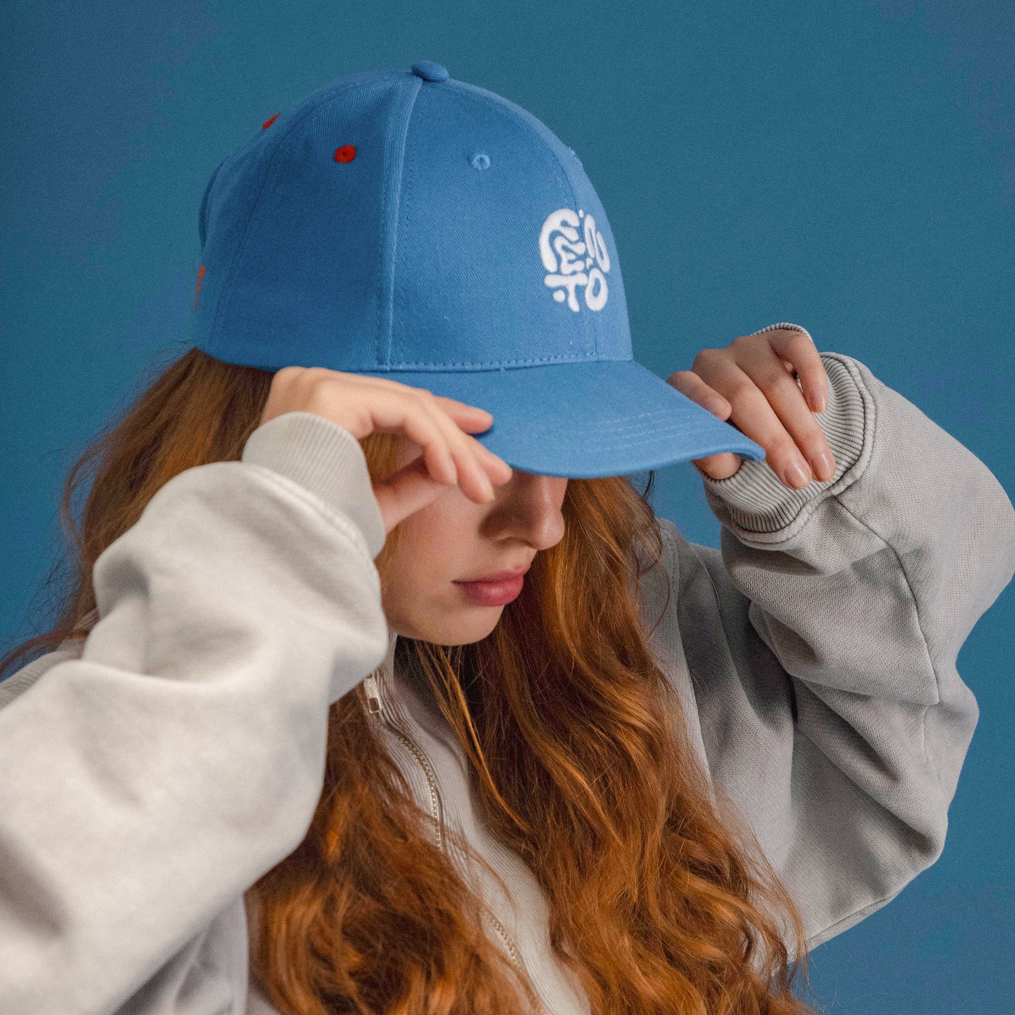 Fento Groovy Cap – indigo blue curved visor cap with signature embroidery.