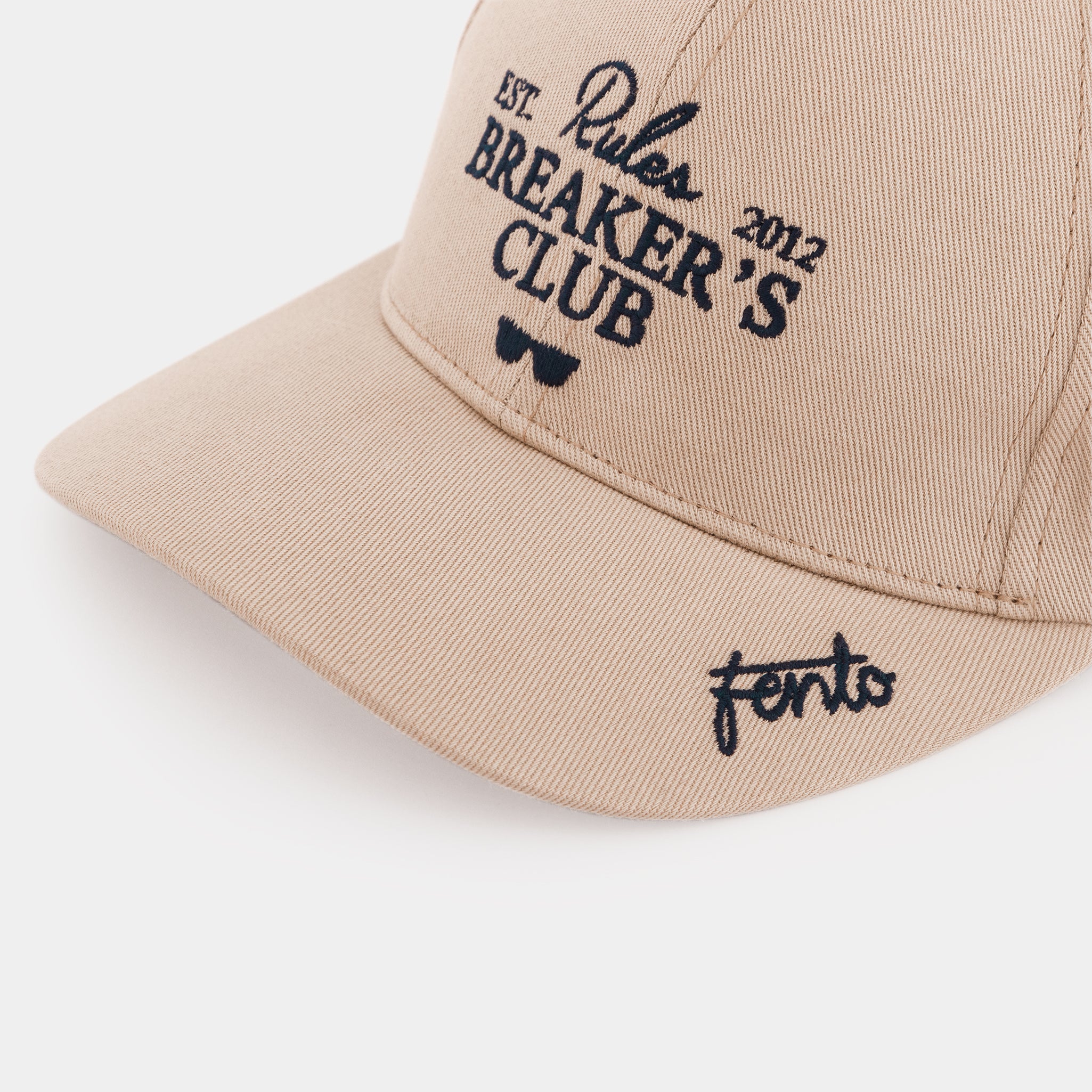 Unisex beige cap Rules Breakers – clean design with bold identity.

